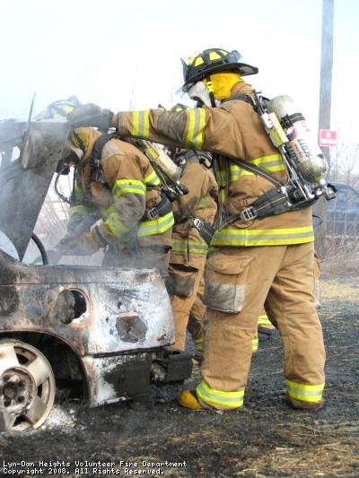 Me opening trunk of burnt car